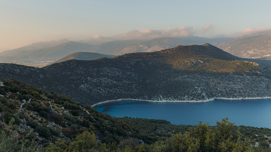 High Angle View of the bright blue sea and the mountains near Kalkan city in South Turkey during beautiful sunset