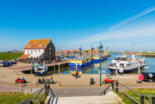 Oudeschild, The Netherlands - April 16, 2022: Fishing harbor of Oudeschild, a town in the Dutch province of North Holland. It is a part of the island municipality of Texel, and lies about 12 km northeast of Den Helder.