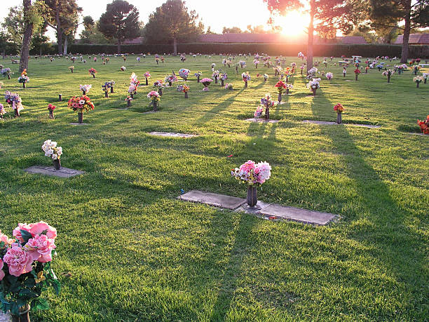 A cemetery with flowers at sunset