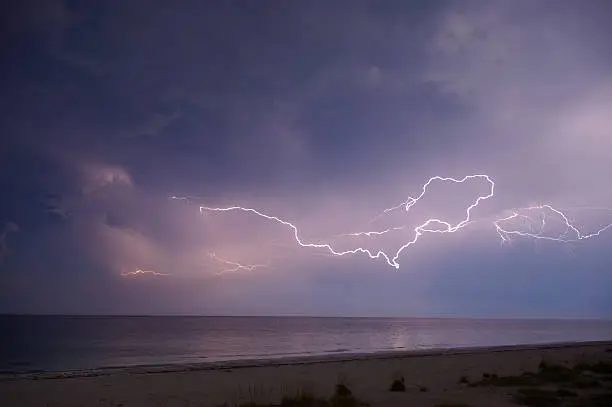 This is a part of a really big horizontal lightning flash, which covered  nearly a 360Â° angle. The picture was made just a few days before the arrival of Hurricane Frances to Florida (here: Anna Maria Island)