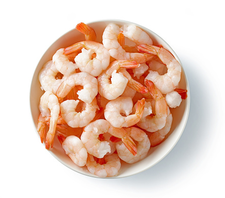 bowl of red prawns isolated on white background, top view