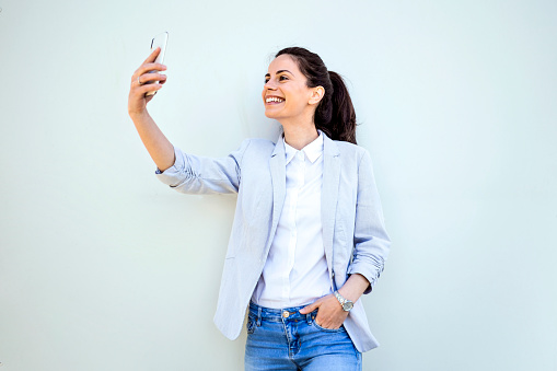 Young beautiful girl taking Selfie