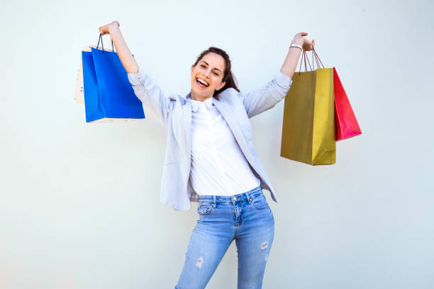 istock Young woman in shopping on white background 1393803814