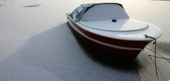 Boat at the frozen lake. (finland)