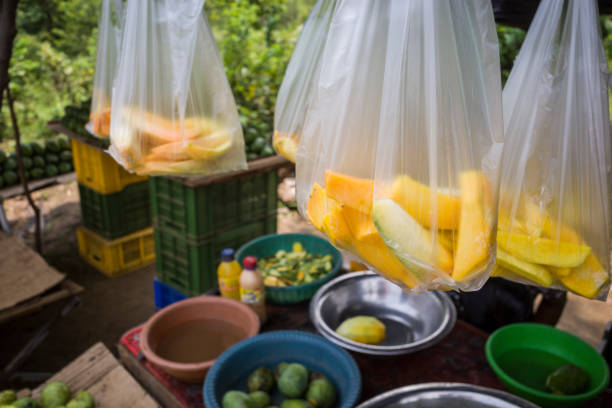 Udawalawa, Sri Lanka Udawalawa, Sri Lanka A farm stand by the side of the road sells fresh fruit like mangoes and pineapple in plastic bags. sri lanka business stock pictures, royalty-free photos & images