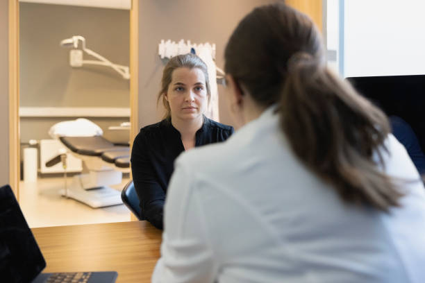 istock Woman visiting general practitioner for health checkup 1393811863