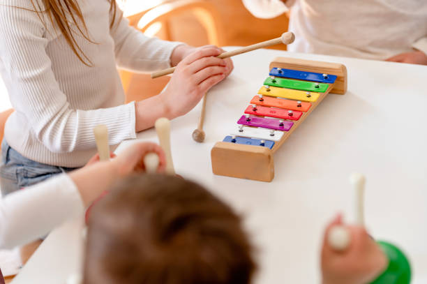 istock Preschool Children Playing Music Using Various Colorful  Instruments 1393812157