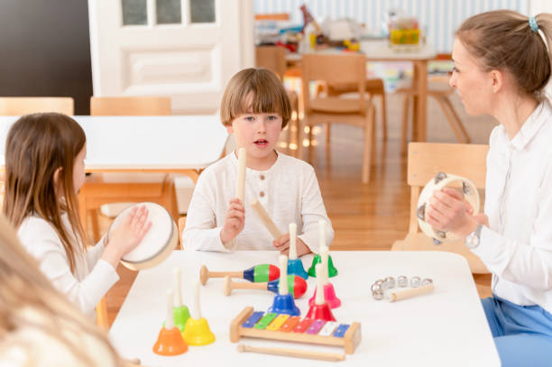 istock Preschool Children Playing Music Using Various Colorful  Instruments 1393815120