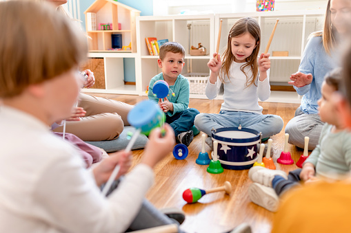 Kindergarten Children Learning Music Using Various Colorful  Instruments. Learning Music for Kids using Colors. Montessori Music Activities for Preschoolers.