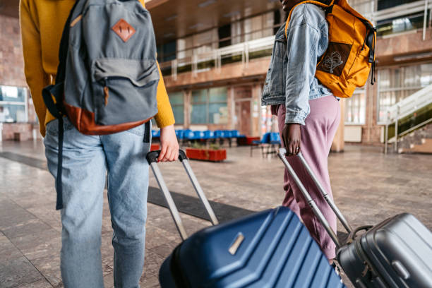 istock Two Young Tourists Arriving At The Station 1393816919