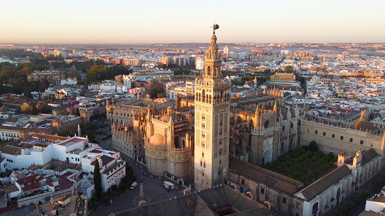Catedral de Sevilla. Drone shot of the beautiful Spanish city of Seville at the sunrise.