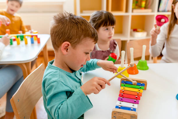 istock Preschool Children Playing Music Using Various Colorful  Instruments 1393820722