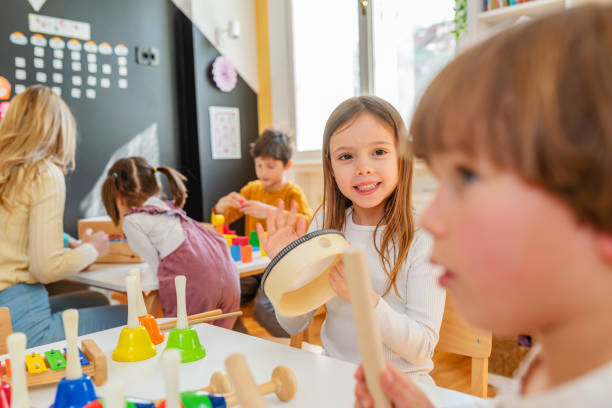 istock Preschool Children Playing Music Using Various Colorful  Instruments 1393822101