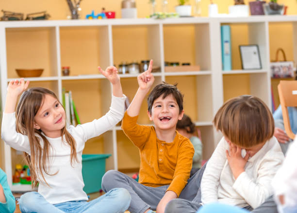 istock Preschool Children Interacting with their Teacher. Healthy learning environment. Learning through play. 1393823828