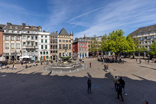Aachen, Germany - Apr 18th 2022: Aachen town square in front of historical town hall is a famous place to spend sundays with friends and family.