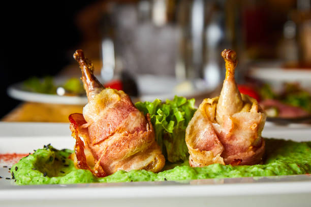 istock Quail mousse in bacon and broccoli puree. Close-up, selective focus 1393826330