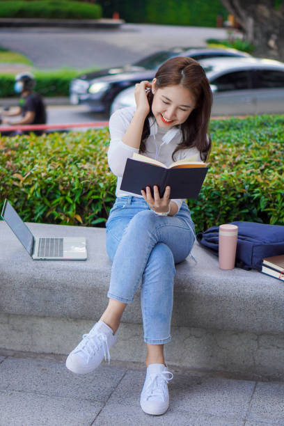 istock Asian students use laptops to study online via the Internet outside the home. outdoor learning and working concept 1393826572