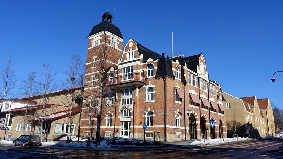 Ostersund, Sweden, March 13, 2022: A view of an impressive historic building in the city center during this winter.