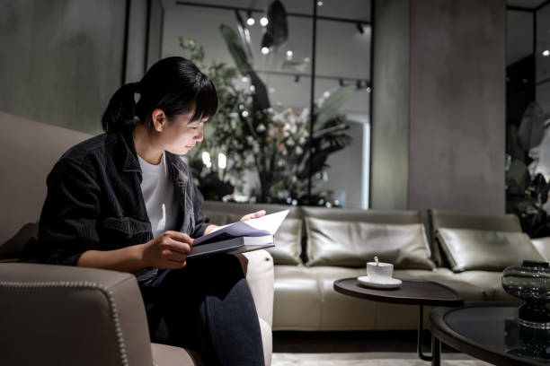 istock An Asian woman enjoys free reading time 1393829128
