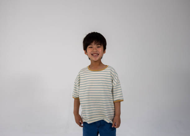 Happy school boy standing arm crossed