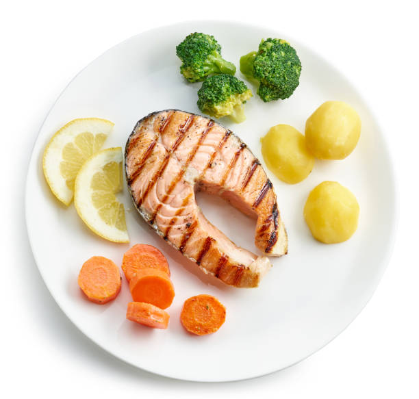 istock plate of grilled salmon steak and vegetables 1393830552