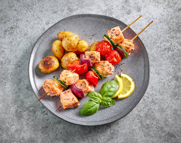 istock grilled salmon skewers and vegetables 1393830592