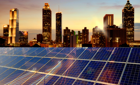 Solar Power Station over urban skyline at sunset. The city is Atlanta - Georgia, USA.