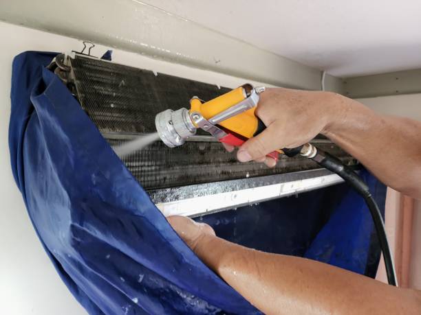 istock Clean the air conditioner by using a high-pressure water gun. 1393832669