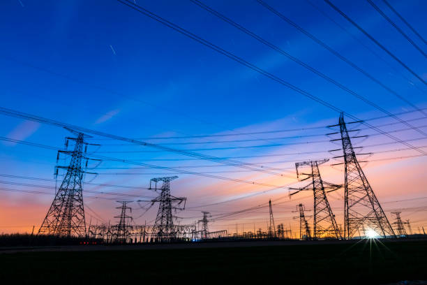 istock Pylons, high voltage pylons in the evening 1393833585
