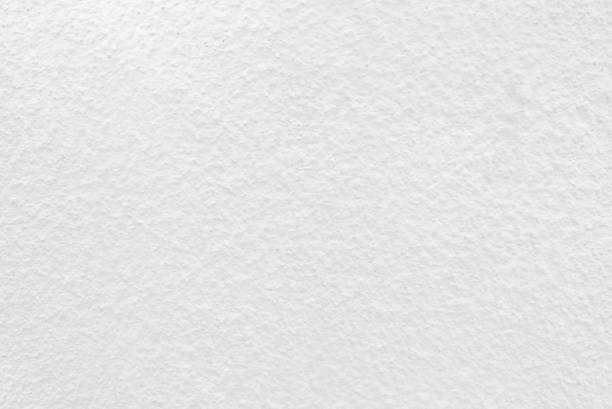 istock Seamless texture of white cement wall a rough surface, with space for text, for a background.