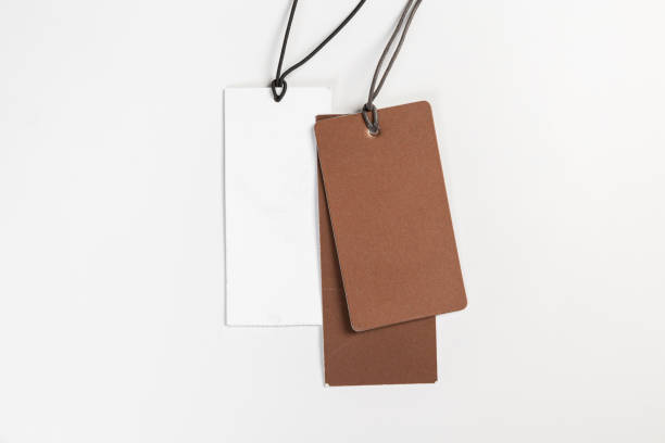 istock two fashionable blank labels for clothes on a gray background 1393836193