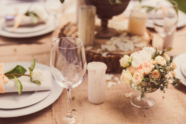 istock Floral composition, candles and plates on decorated table. 1393837625