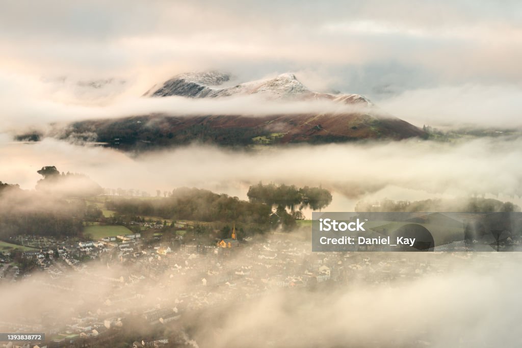 Derwentwater Seen From Latrigg, Lake District, UK. Aerial view of Keswick and Derwentwater with snowcapped mountains on a Winter morning. Lake District, UK. Viewpoint Stock Photo