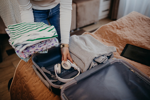 Women Unpack In The Hotel Room Stock Photo - Download Image Now ...