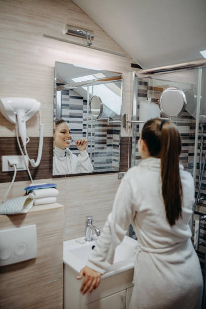 istock Woman is brushing her teeth 1393838924