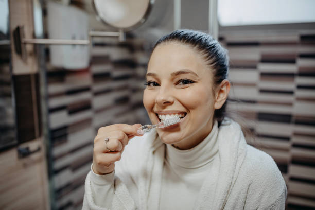 istock Woman is brushing her teeth 1393838942