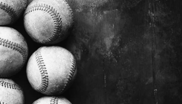 istock Old baseball background in black and white with group of balls 1393841882