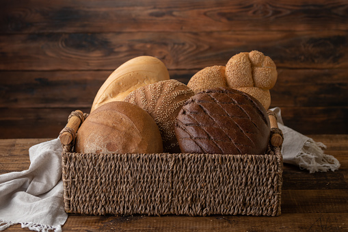 Natural bread loaf on wooden background