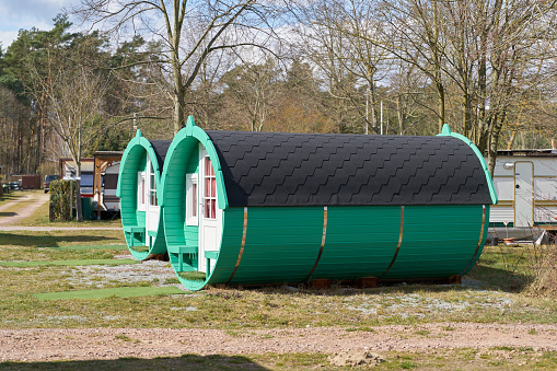Plötzky, Germany – March 19, 2022: Wooden sleeping barrel to spend the night on a campsite in Germany