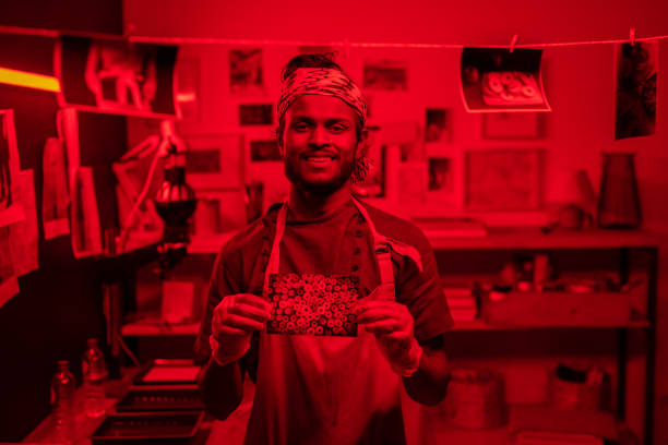 istock Cheerful Photographer With Photo Developed 1393844832