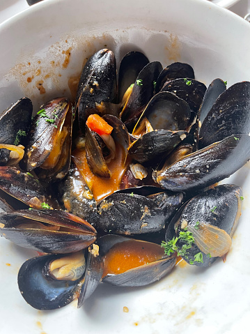 Steamed mussels in a serving bowl