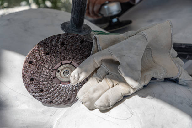 tools for working marble: circular saw and protective gloves stock photo