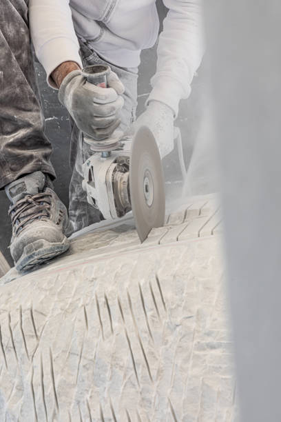 istock artist who works marble with circular saw 1393846500