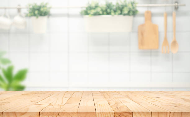 istock Selective focus.Wood table top on blur kitchen counter background.F 1393846660