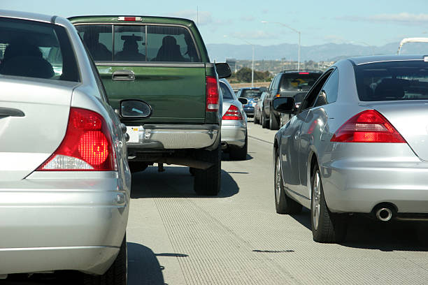 Traffic on 405 freeway in California Bumper to bumper traffic on 405 Freeway in California, south of Los Angeles bumper stock pictures, royalty-free photos & images