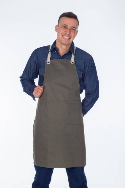 istock Latin man dressed in apron uniforms looks towards the camera 1393847791