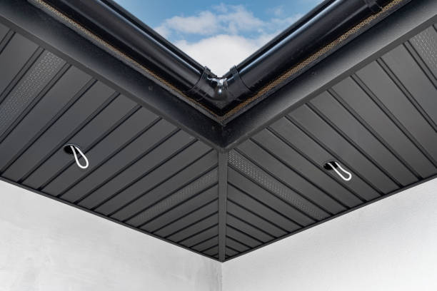 istock A modern graphite herringbone roof lining is attached to the trusses, visible cables and holes for LED lighting. 1393848763