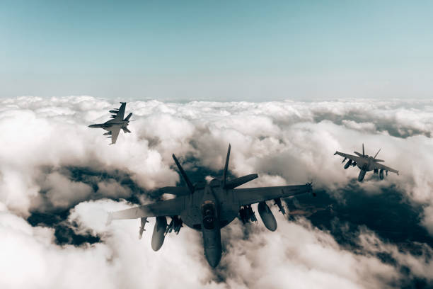 istock Jet fighters flying over the clouds. 1393850398
