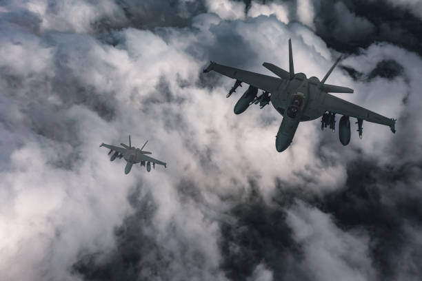 istock Jet fighters flying over the clouds. 1393850446