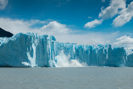 A piece of ice from the Perito Moreno glacier in Patagonia, Argentina, breaks off